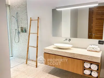 Modern bathroom with elegant vanity and walk-in shower
