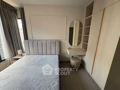 Modern bedroom with stylish decor, featuring a plush bed, built-in wardrobe, and elegant vanity area.