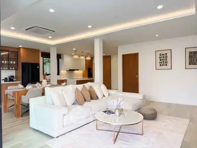 Spacious modern living room with open kitchen and elegant decor