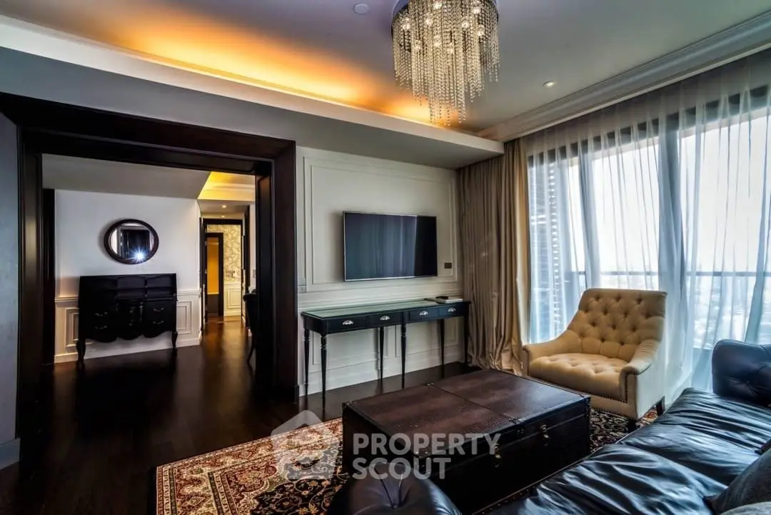 Luxurious living room with elegant chandelier and large window view