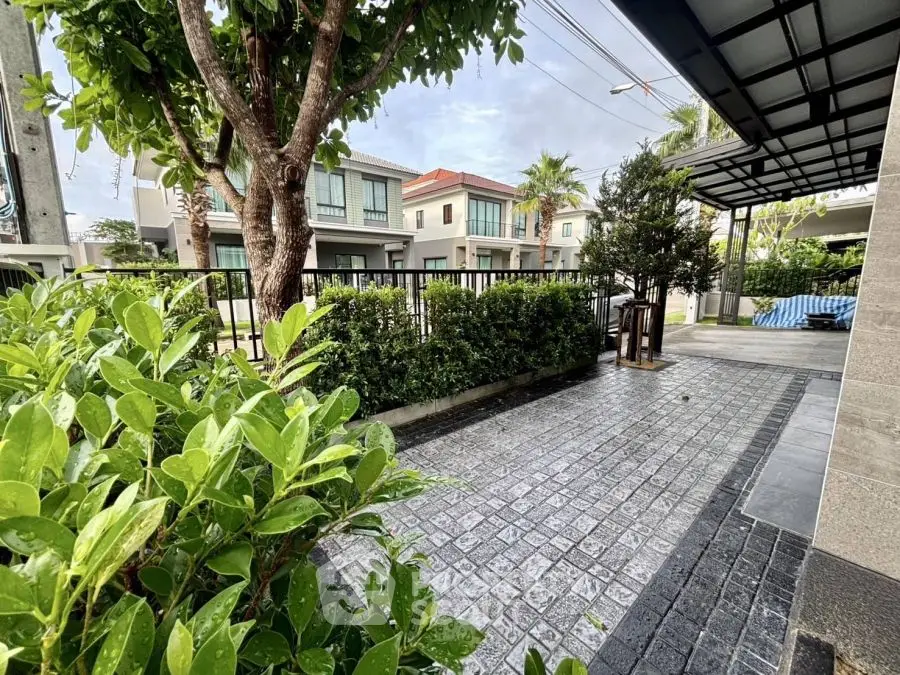 Charming residential neighborhood with lush greenery and modern homes.
