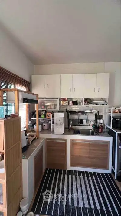 Modern kitchen with closed layout and sleek appliances