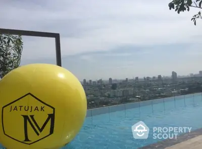 Luxurious rooftop pool with stunning city skyline view at Jatujak M.