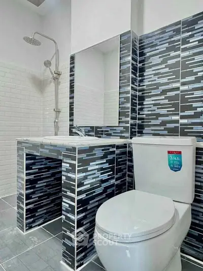 Modern bathroom with stylish tile design and sleek fixtures.