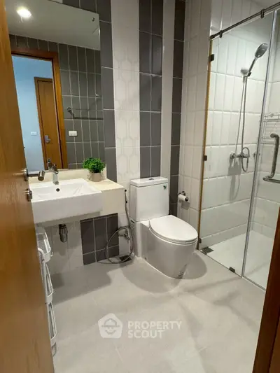 Modern bathroom with sleek design and glass shower enclosure