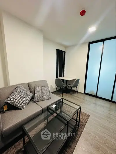 Modern living room with sleek furniture and stylish decor in a contemporary apartment.