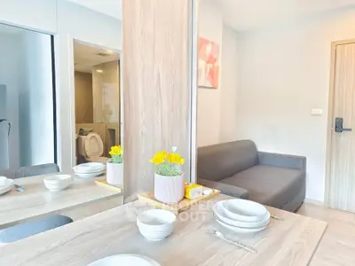 Modern living room with cozy sofa and dining area in a stylish apartment