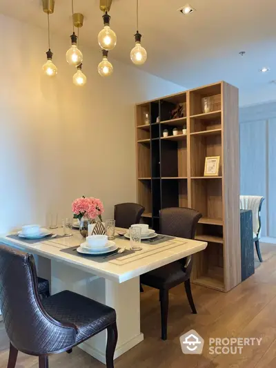 Elegant dining area with modern lighting and stylish decor in a contemporary apartment