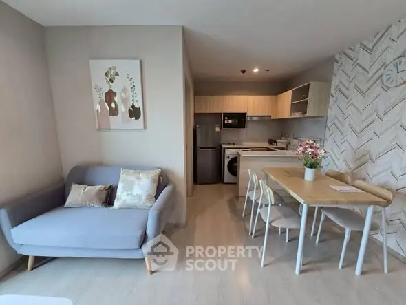 Modern open-plan living room with stylish kitchen and dining area