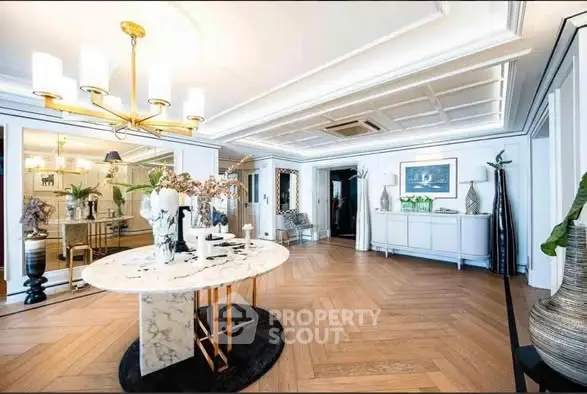 Luxurious living room with elegant decor and marble table in upscale apartment