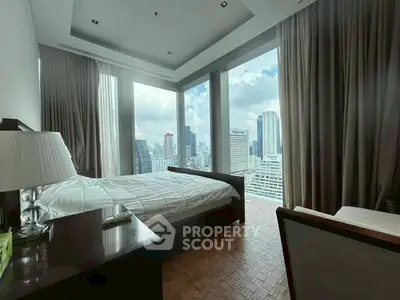 Luxurious bedroom with stunning city view and floor-to-ceiling windows