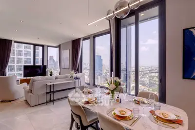 Luxurious open-plan living room with panoramic city views and elegant dining area.