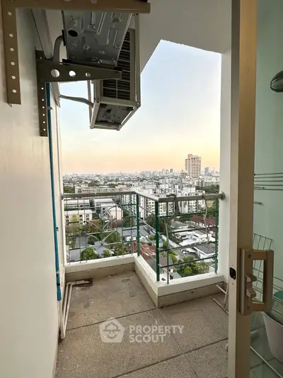 High-rise balcony with cityscape view, perfect for urban living enthusiasts.