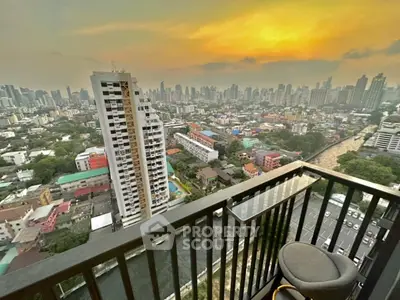 Stunning cityscape view from high-rise balcony at sunset