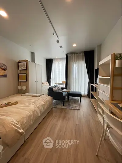 Modern studio apartment with cozy living area and stylish decor
