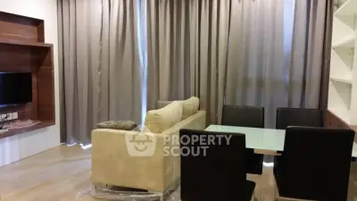 Modern living room with elegant dining area and cozy sofa