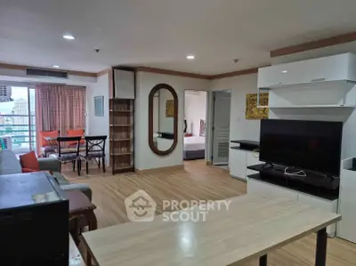 Spacious open-plan living room with modern decor and city view