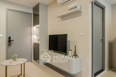 Modern living room with wall-mounted TV and stylish decor