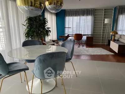 Stylish modern living room with elegant dining area and chic decor