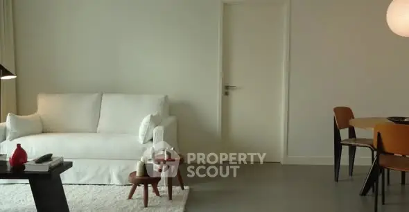 Modern living room with minimalist decor and cozy seating area