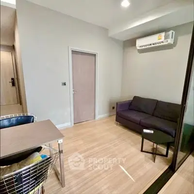 Modern living room with sleek design and air conditioning