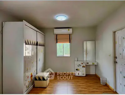 Spacious bedroom with modern decor and ample natural light