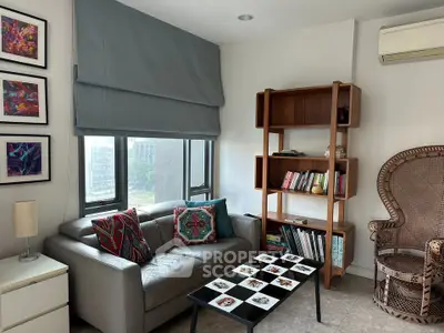 Chic living room with modern decor, cozy sofa, stylish bookshelf, and natural light from large windows.