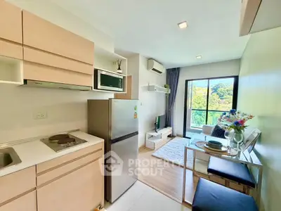 Modern open-layout kitchen and living area with balcony view in stylish apartment