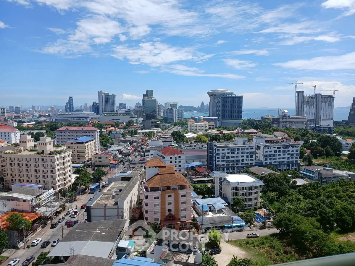 Stunning cityscape view showcasing urban skyline and vibrant neighborhood under a clear blue sky.