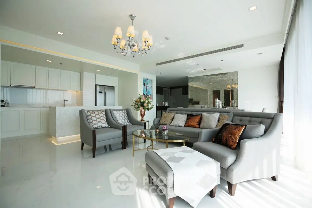 Luxurious open-layout living room with elegant decor and modern kitchen