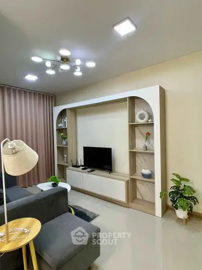 Modern living room with stylish TV unit and elegant decor