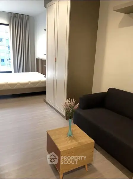 Modern studio apartment with cozy living area and stylish decor