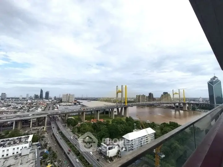 Stunning cityscape view with iconic bridge and river from high-rise balcony.