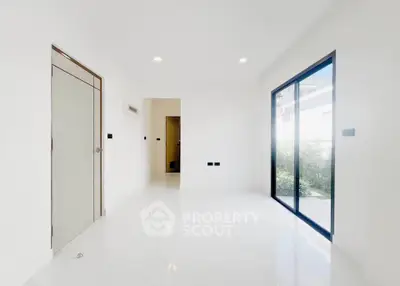 Spacious and bright interior with large windows and modern design, perfect for a contemporary lifestyle.
