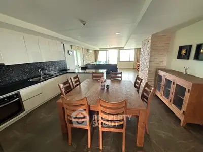 Spacious open-layout kitchen with dining area and modern appliances