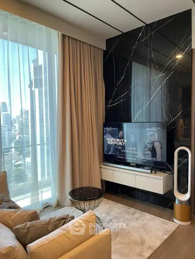Luxurious living room with modern decor and city view, featuring a sleek TV setup.
