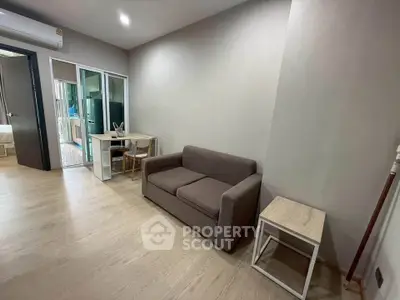 Modern living room with cozy sofa and dining area in stylish apartment