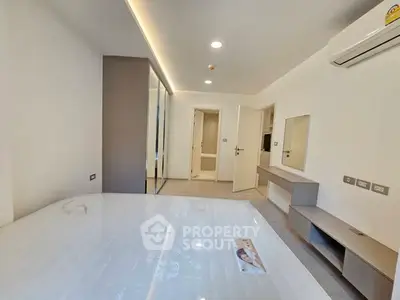 Modern bedroom with sleek design and built-in storage solutions
