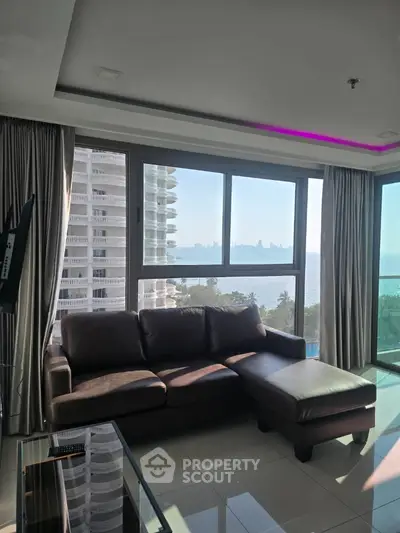 Luxurious living room with stunning ocean view and modern leather sofa
