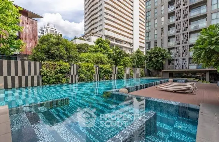 Luxurious urban swimming pool with modern high-rise buildings and lush greenery.