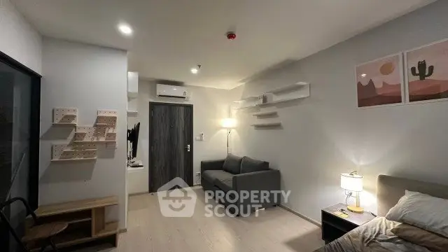 Modern living room with stylish decor and cozy ambiance in a contemporary apartment.