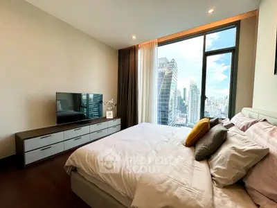 Luxurious bedroom with stunning city view and modern decor