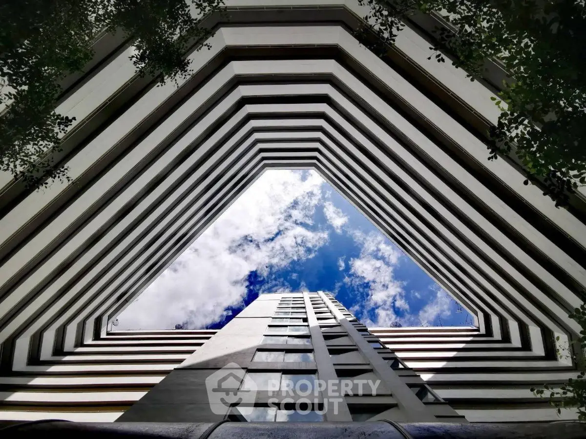 Stunning architectural view of a modern building with a skyward perspective.
