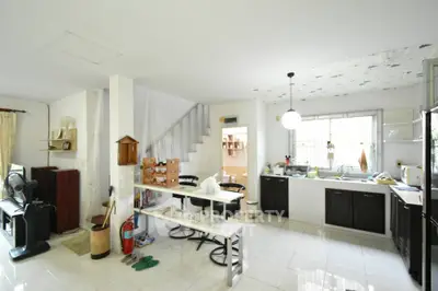 Spacious open-layout kitchen with modern design and ample natural light