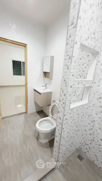 Modern bathroom with sleek design and tiled shower area
