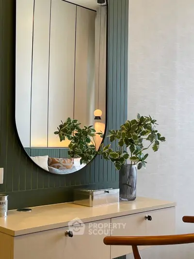 Stylish modern bedroom with elegant mirror and chic decor