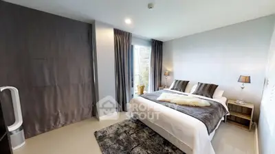 Luxurious bedroom with modern decor and large window offering natural light