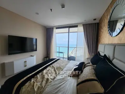 Luxurious bedroom with ocean view and modern decor in high-rise apartment