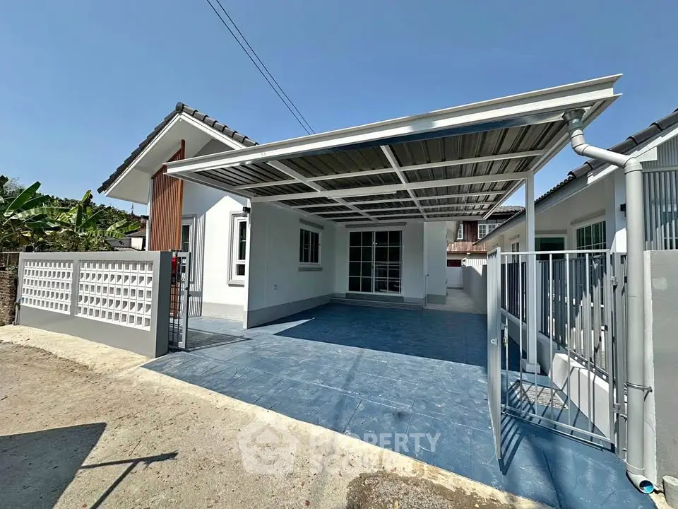 Charming single-story home with spacious carport and modern exterior design.