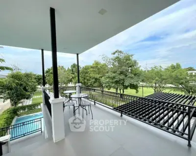 Spacious balcony with scenic view and modern outdoor seating